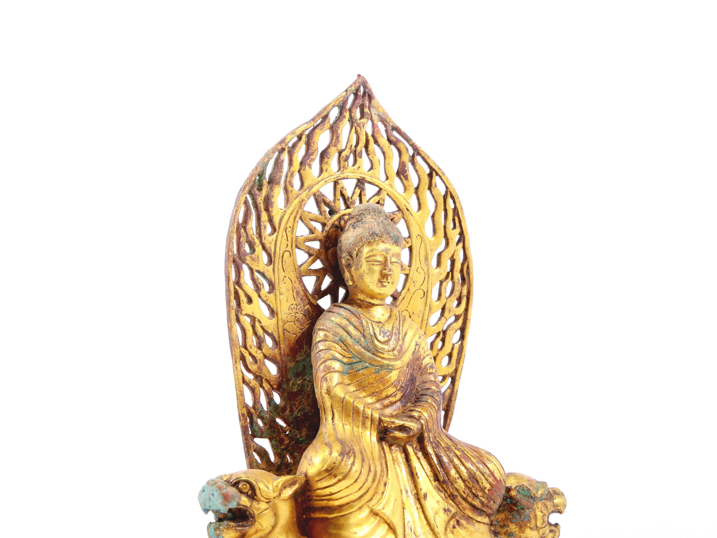 A serene gilt bronze statue of Gautama Buddha