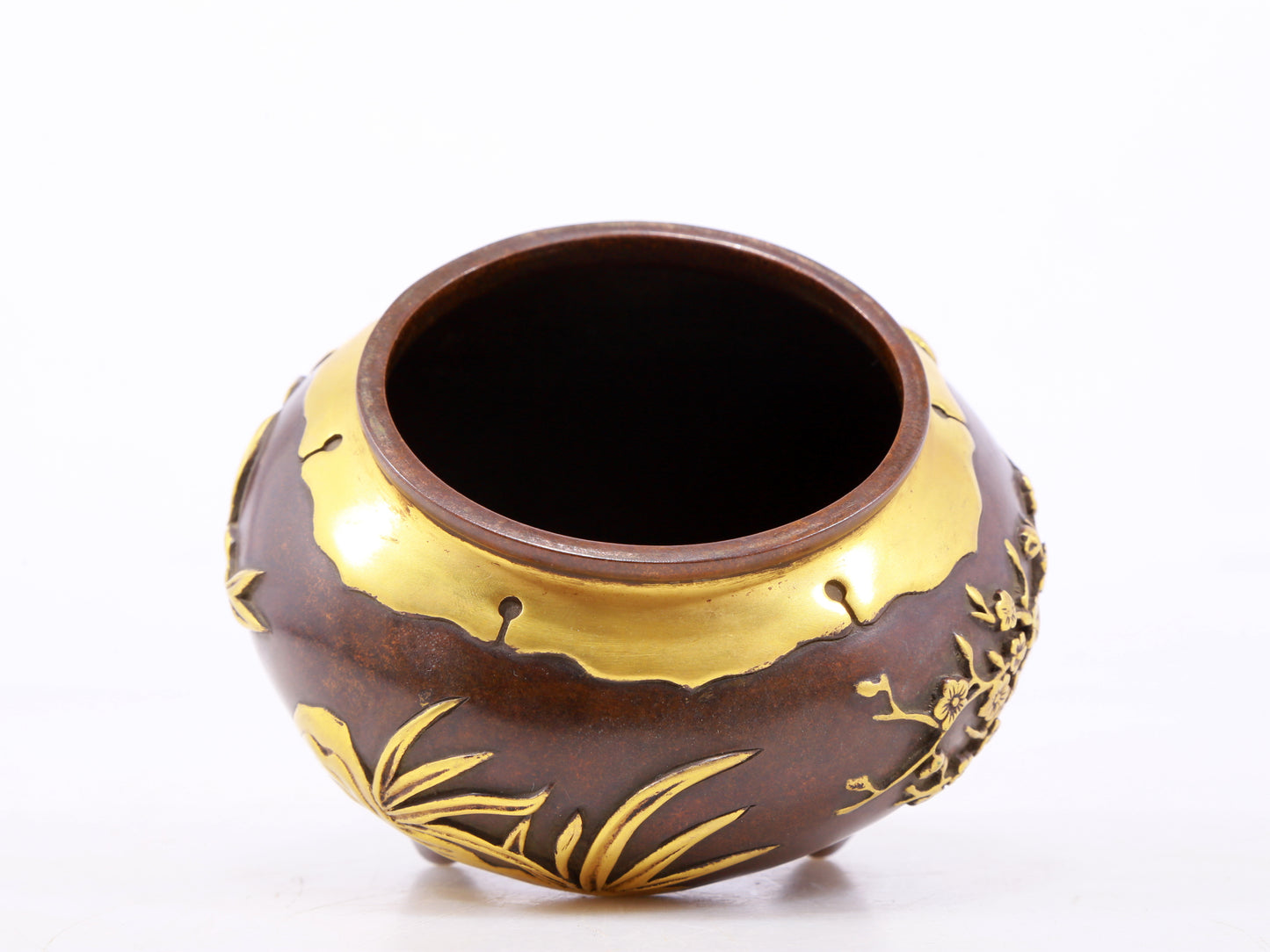 An exquisite gilt copper tripod censer with floral patterns