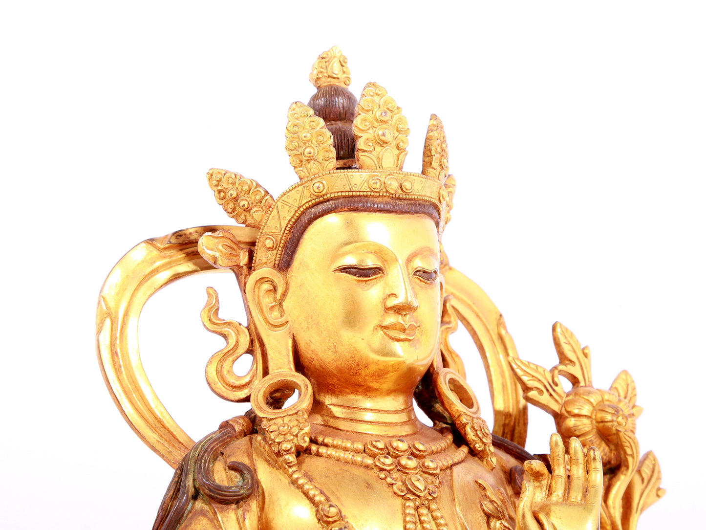 A solemn gilt bronze statue of green Tara