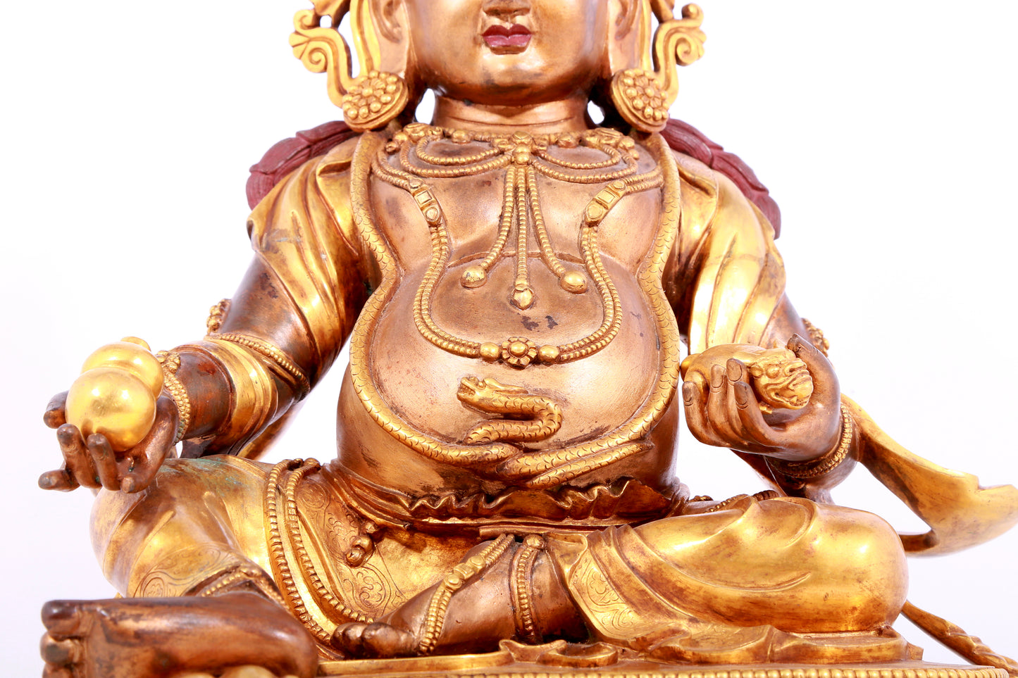 A solemn gilt bronze statue of Mammon