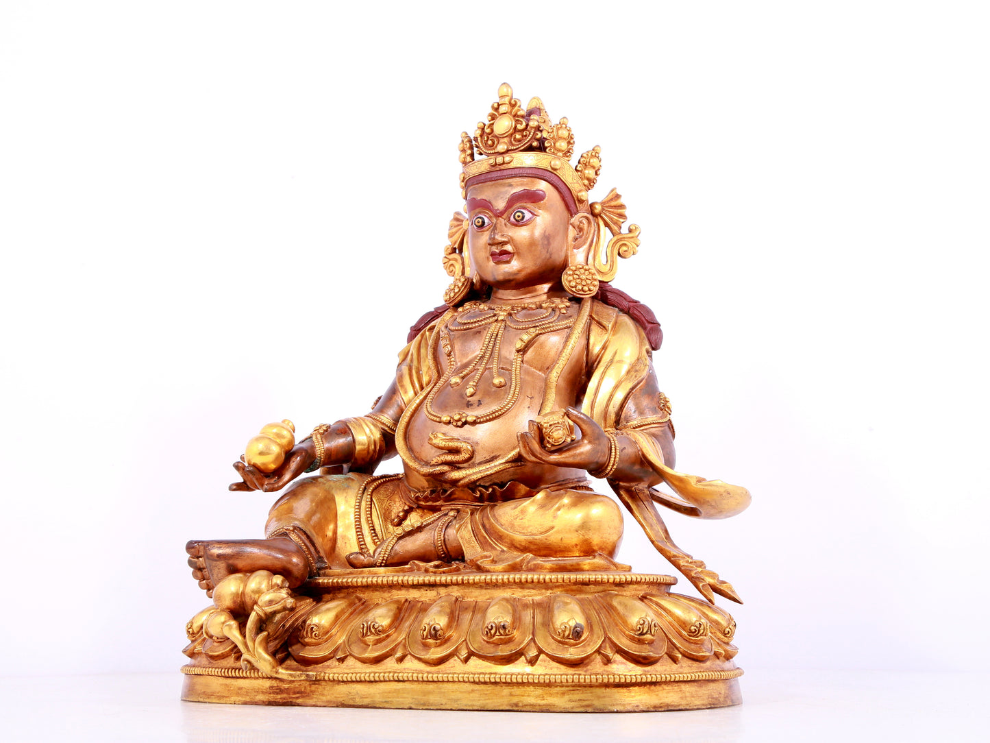 A solemn gilt bronze statue of Mammon