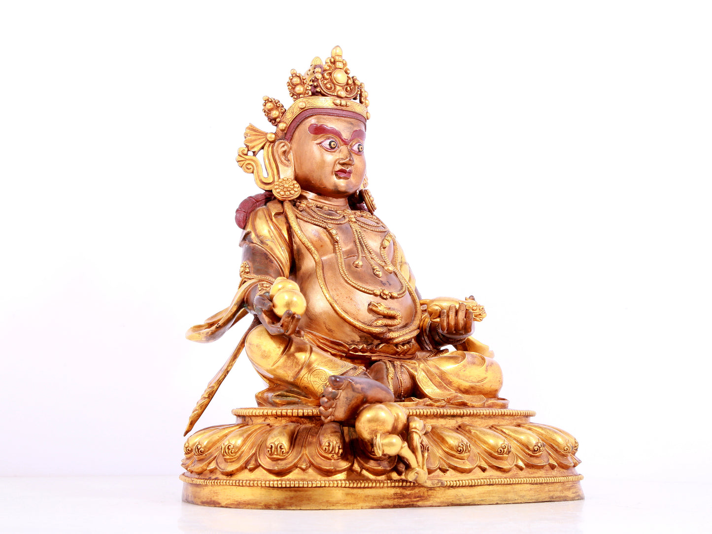 A solemn gilt bronze statue of Mammon