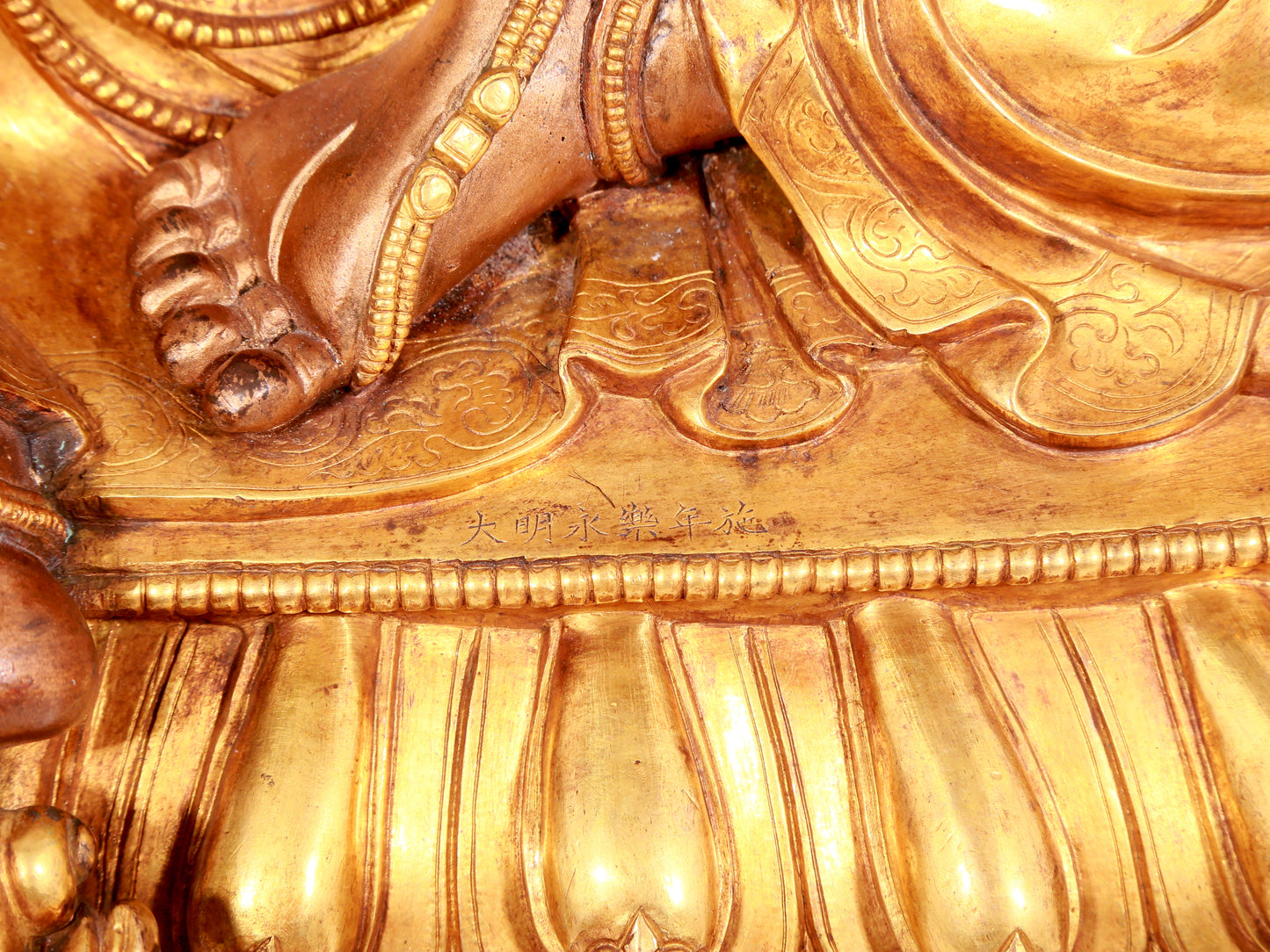 A solemn gilt bronze statue of Mammon
