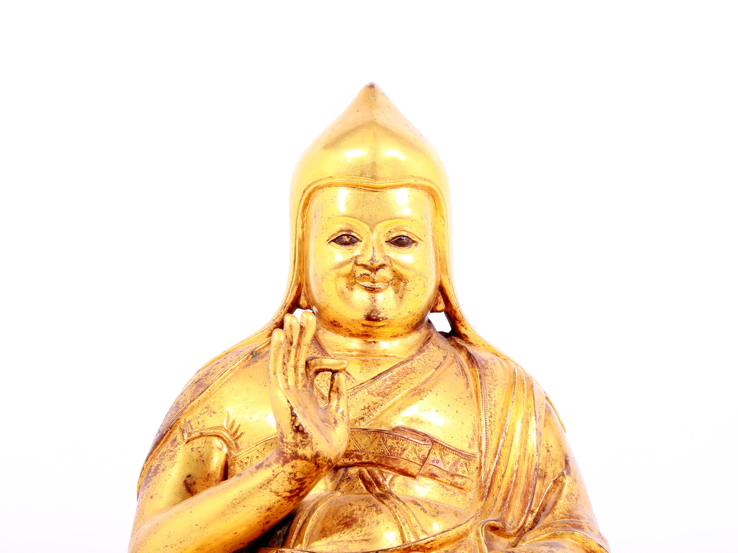 A solemn gilt bronze statue of Tsongkhapa