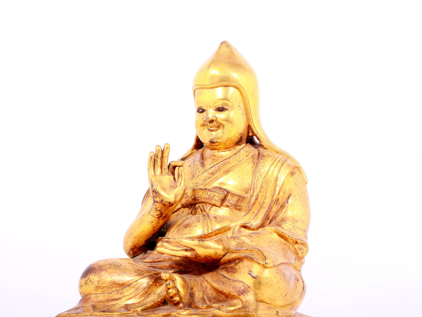 A solemn gilt bronze statue of Tsongkhapa