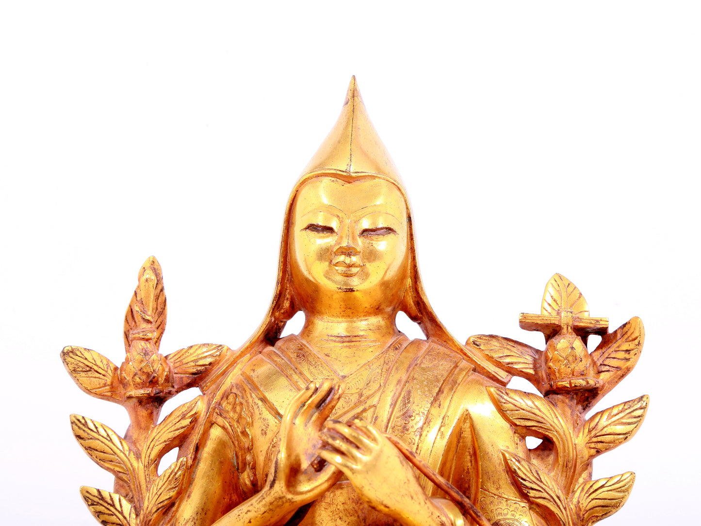 A solemn gilt bronze statue of Tsongkhapa