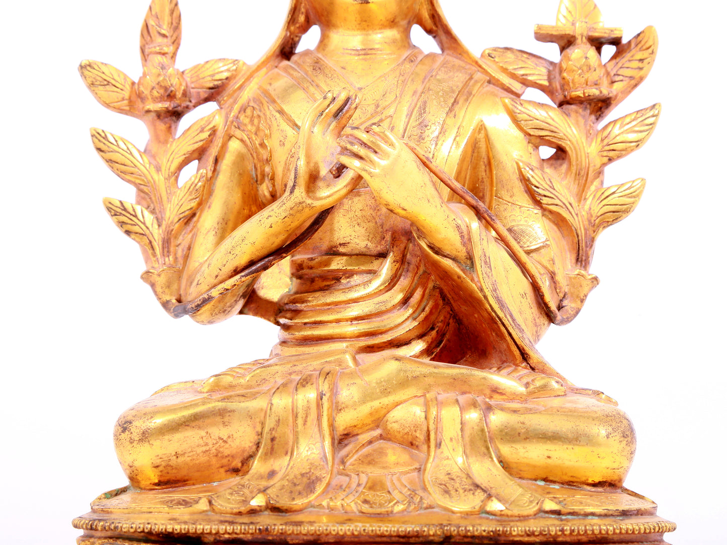 A solemn gilt bronze statue of Tsongkhapa