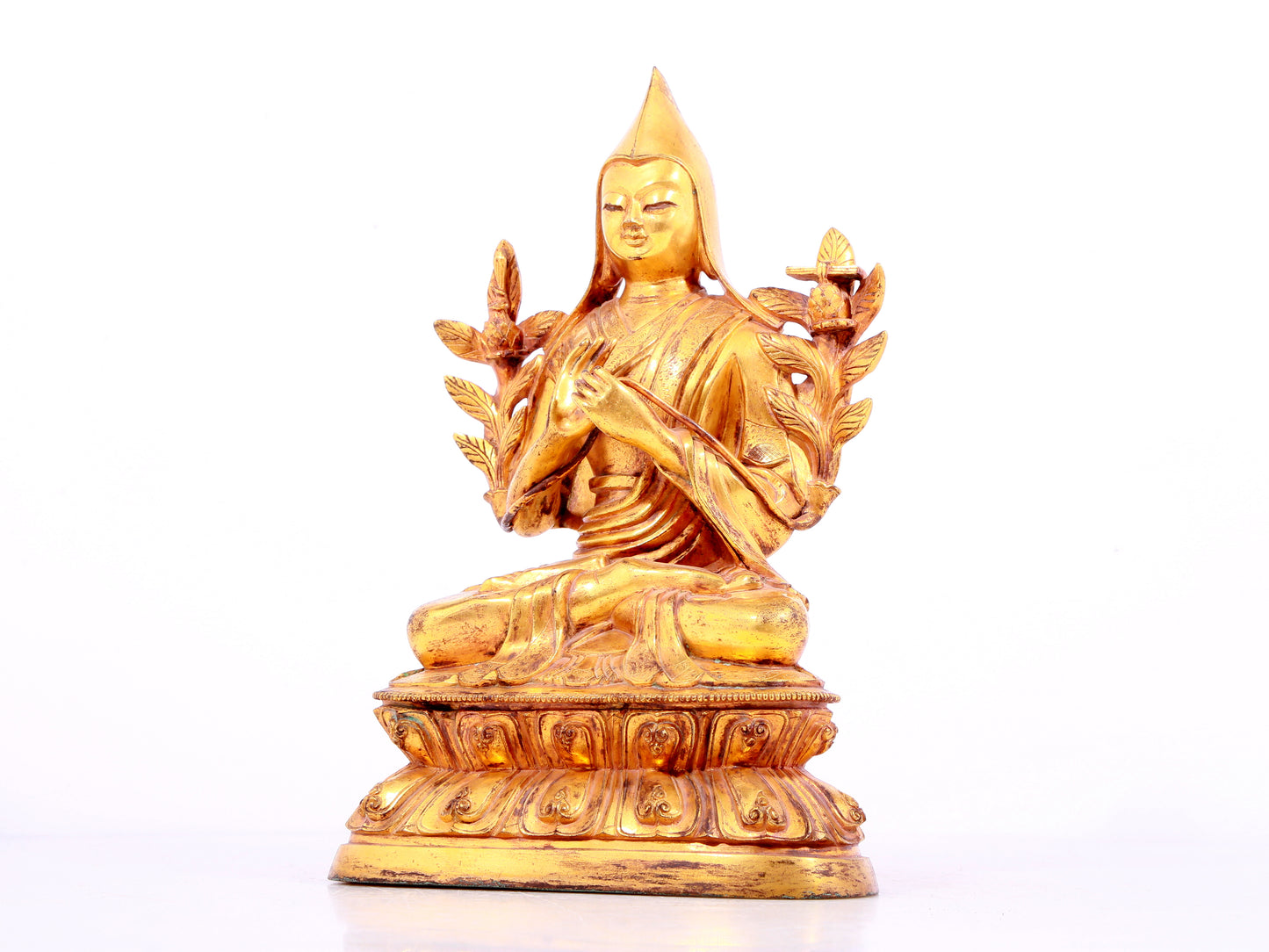 A solemn gilt bronze statue of Tsongkhapa