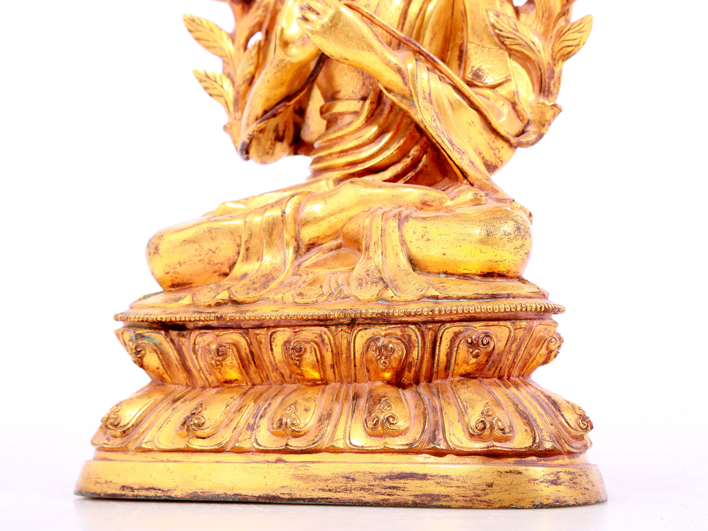 A solemn gilt bronze statue of Tsongkhapa