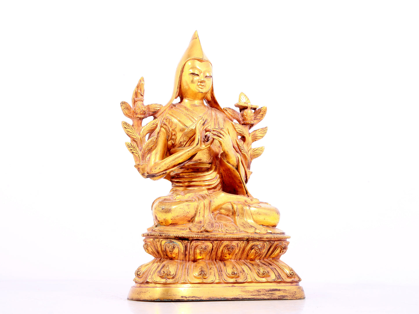 A solemn gilt bronze statue of Tsongkhapa