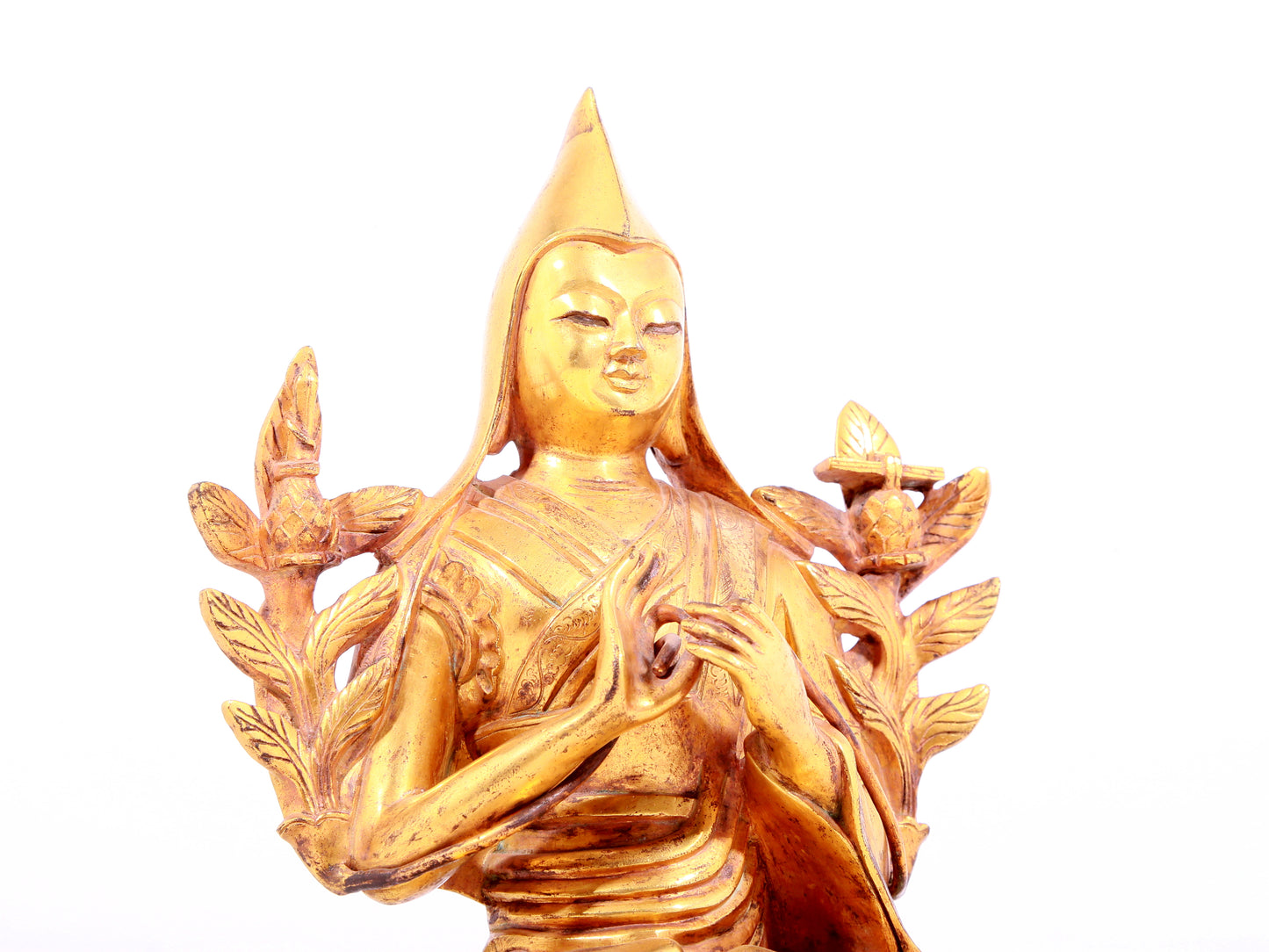 A solemn gilt bronze statue of Tsongkhapa