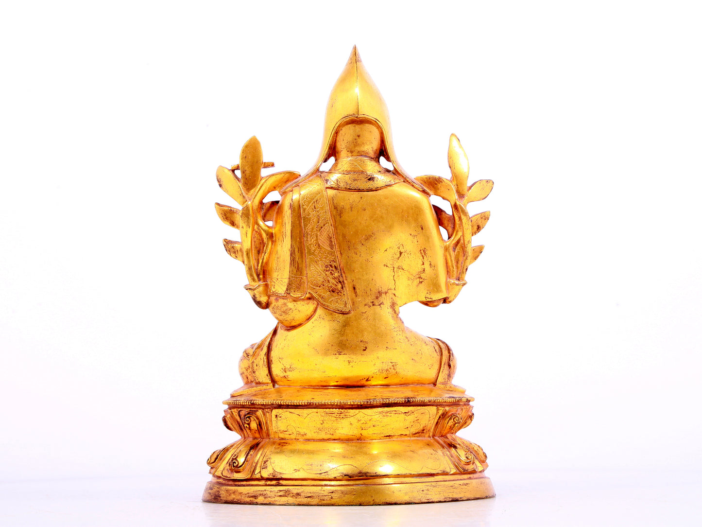 A solemn gilt bronze statue of Tsongkhapa