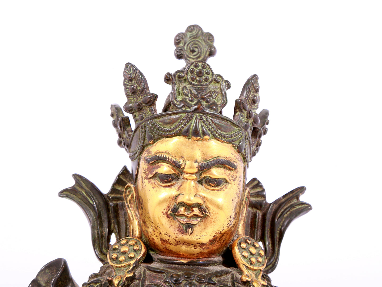 A solemn gilt bronze statue of the King of Treasures