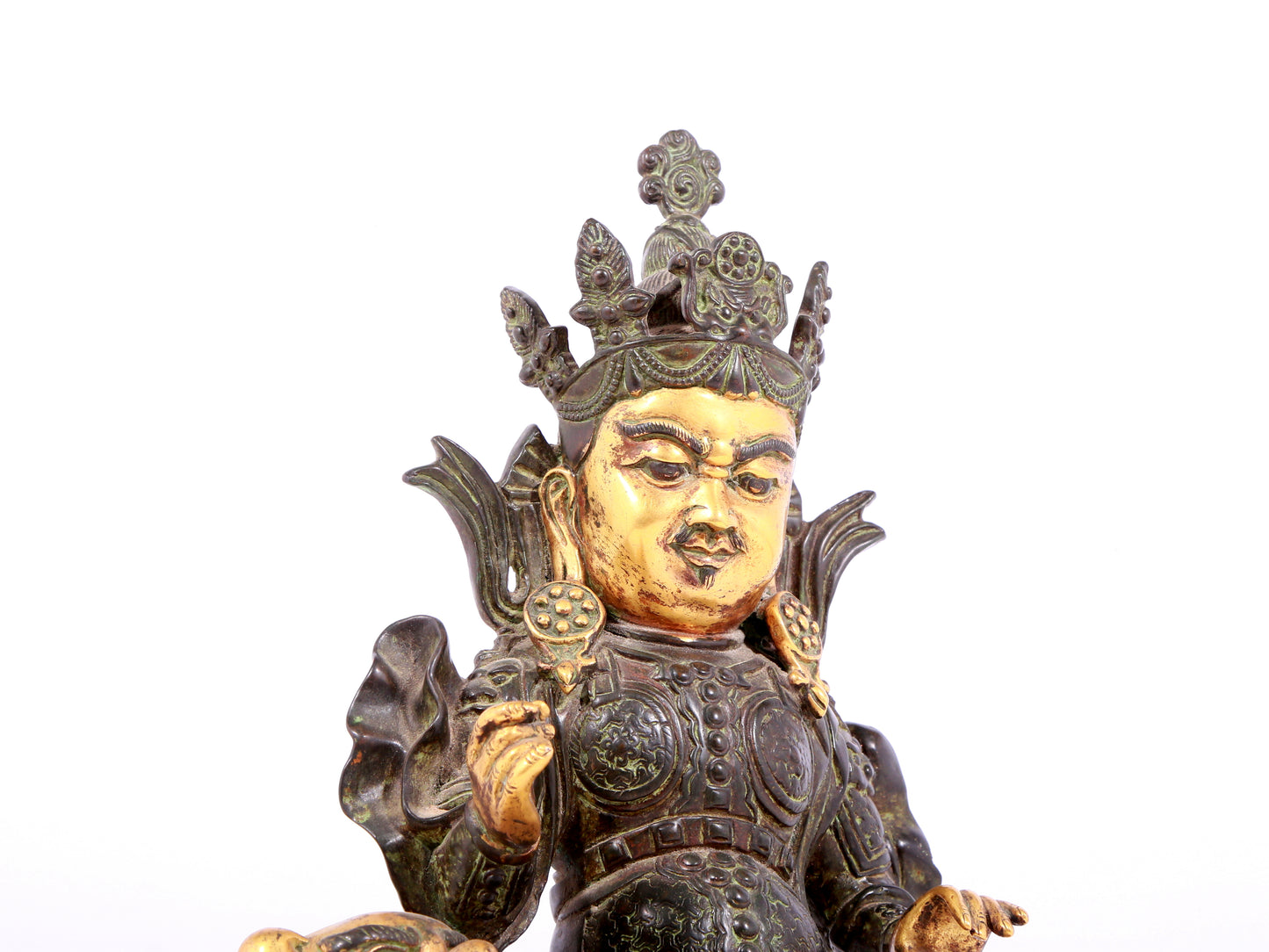 A solemn gilt bronze statue of the King of Treasures