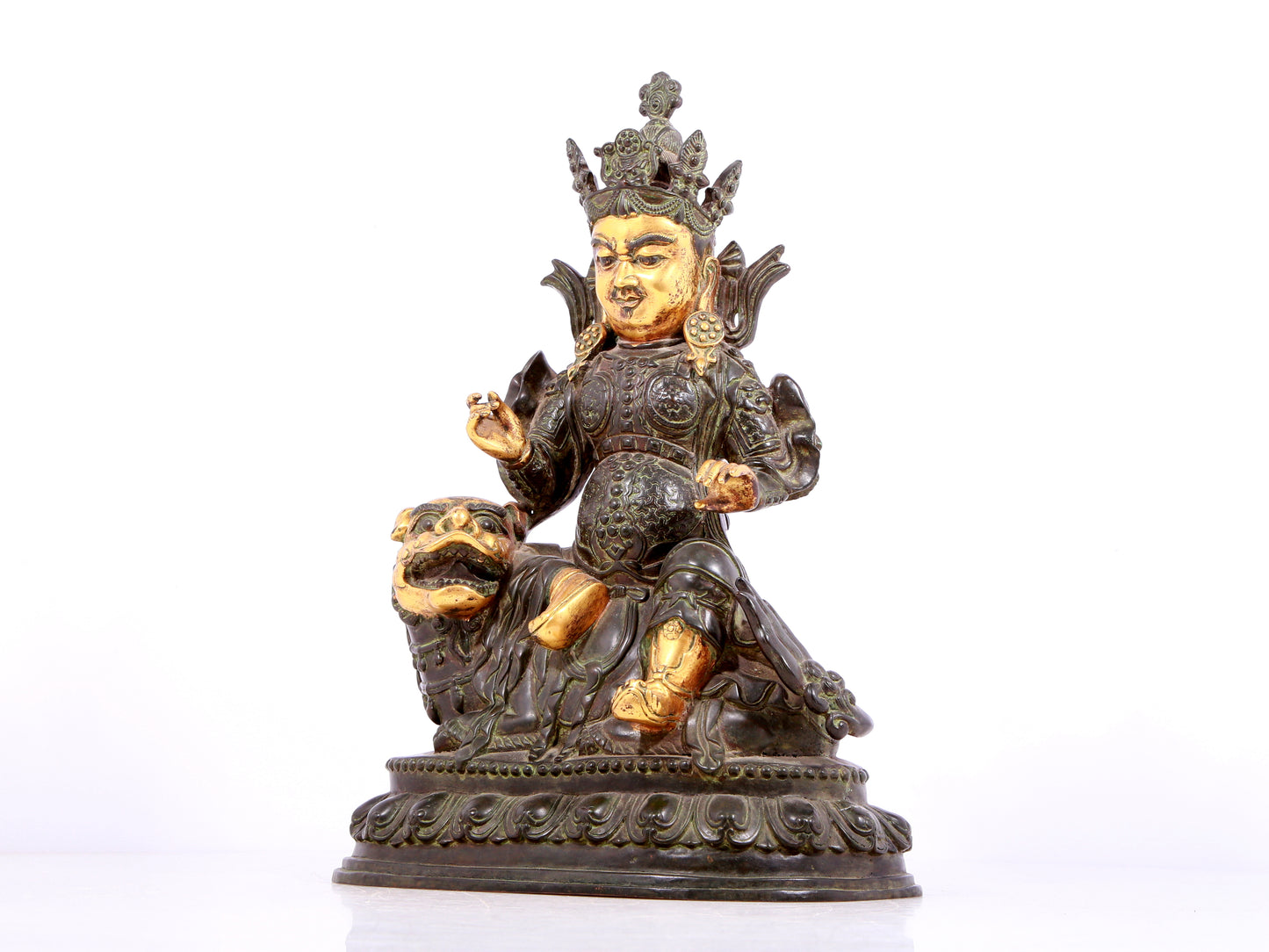 A solemn gilt bronze statue of the King of Treasures