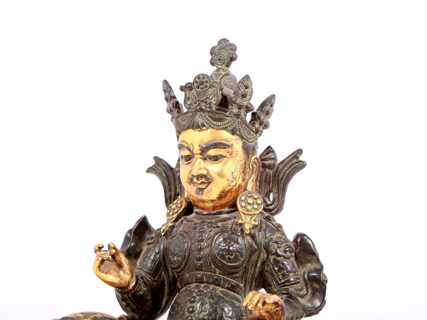 A solemn gilt bronze statue of the King of Treasures