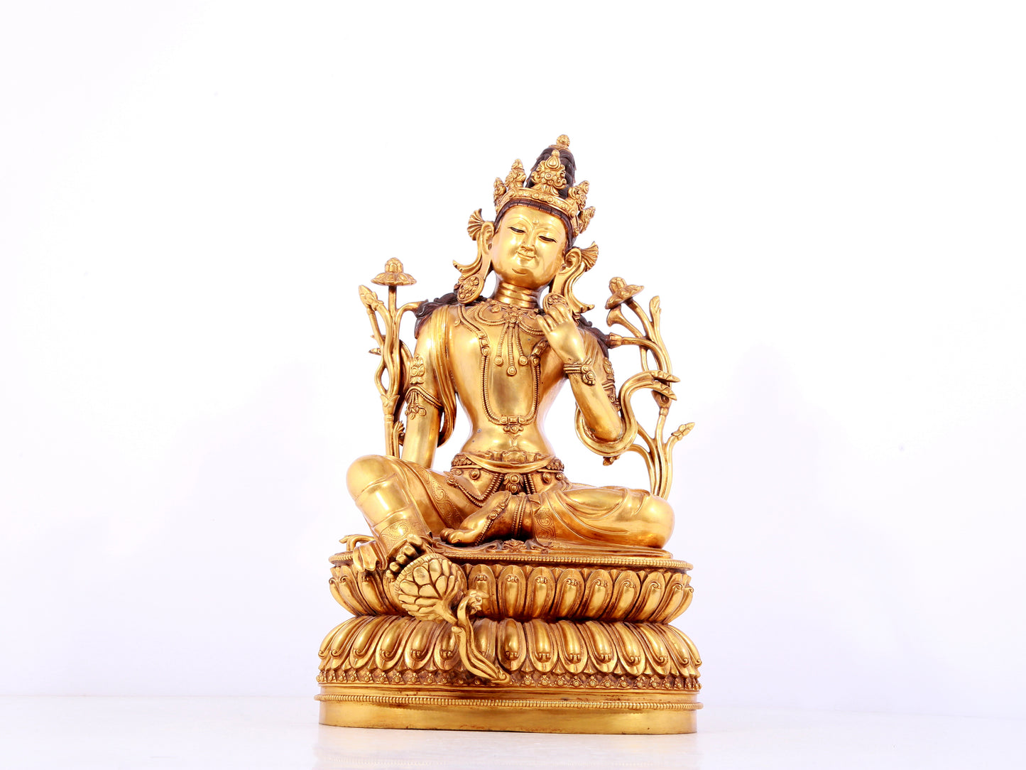A solemn gilt copper green tara