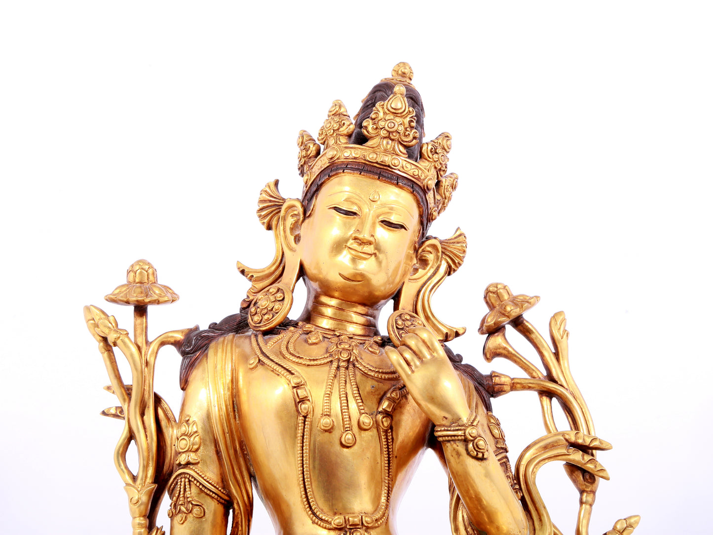 A solemn gilt copper green tara