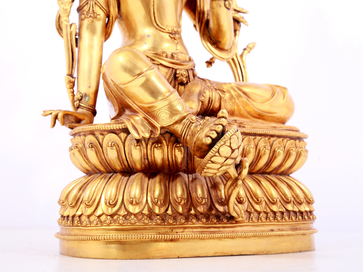 A solemn gilt copper green tara