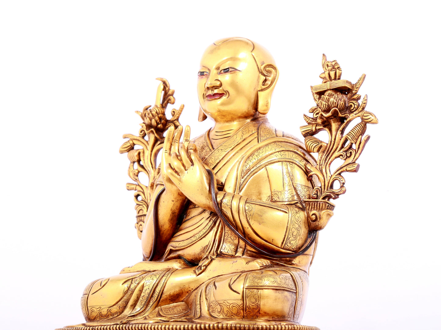 A solemn gilt bronze statue of guru