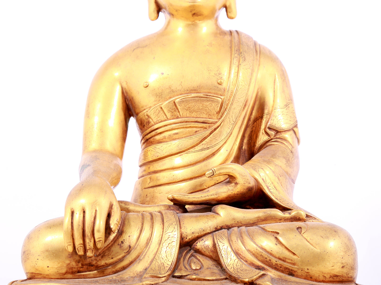 A solemn gilt bronze statue of Sakyamuni