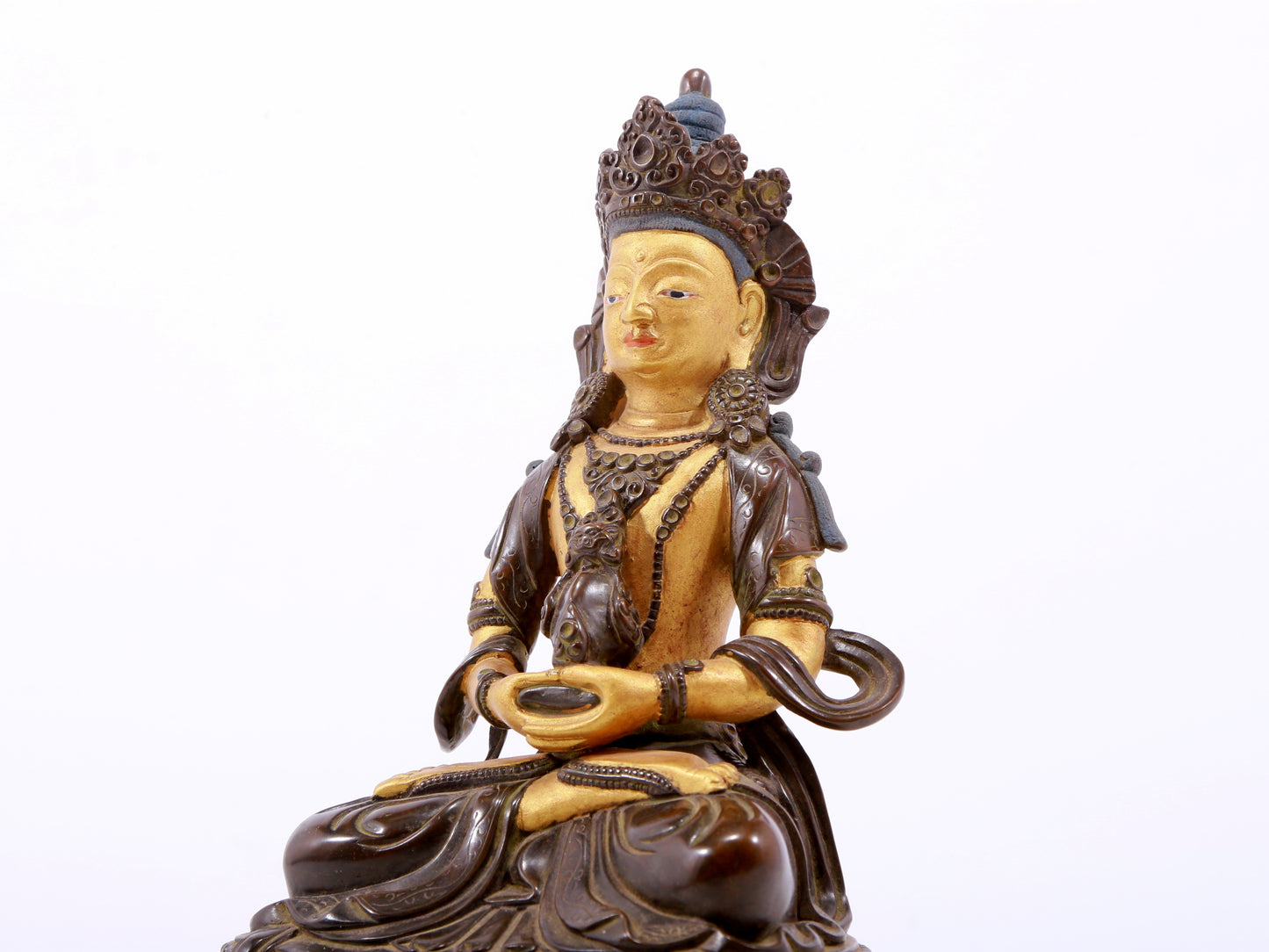 A serene gilt bronze statue of Amitayus Buddha