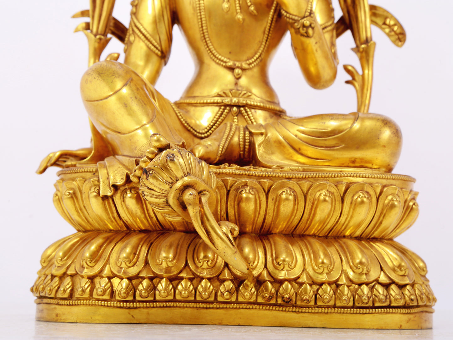 A stunning gilt bronze green Tara statue