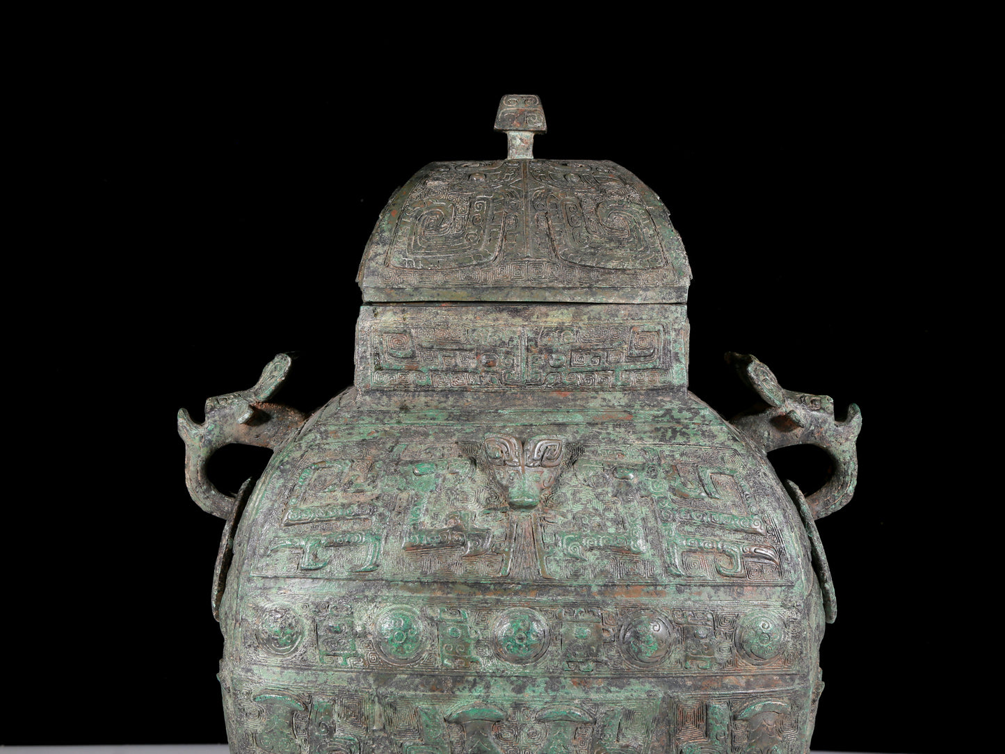A rare bronze animal-faced amphora with lid