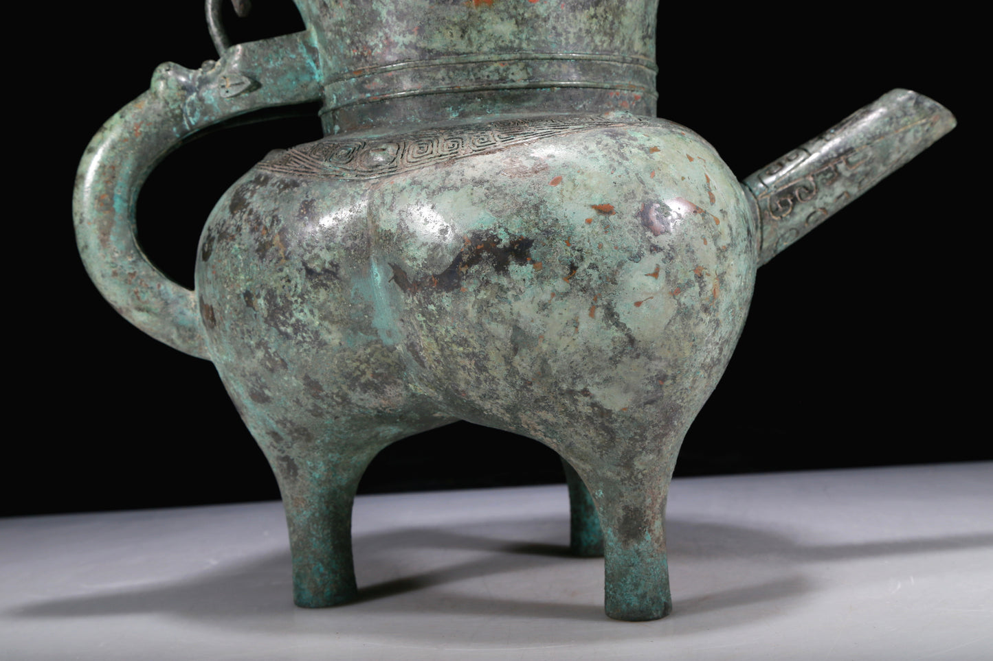 An Excellent Bronze 'Auspicious Beast' Tripod Ewer