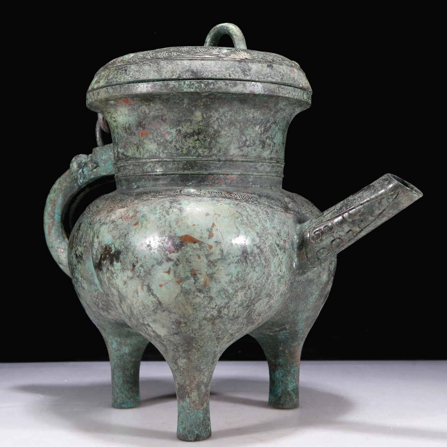 An Excellent Bronze 'Auspicious Beast' Tripod Ewer