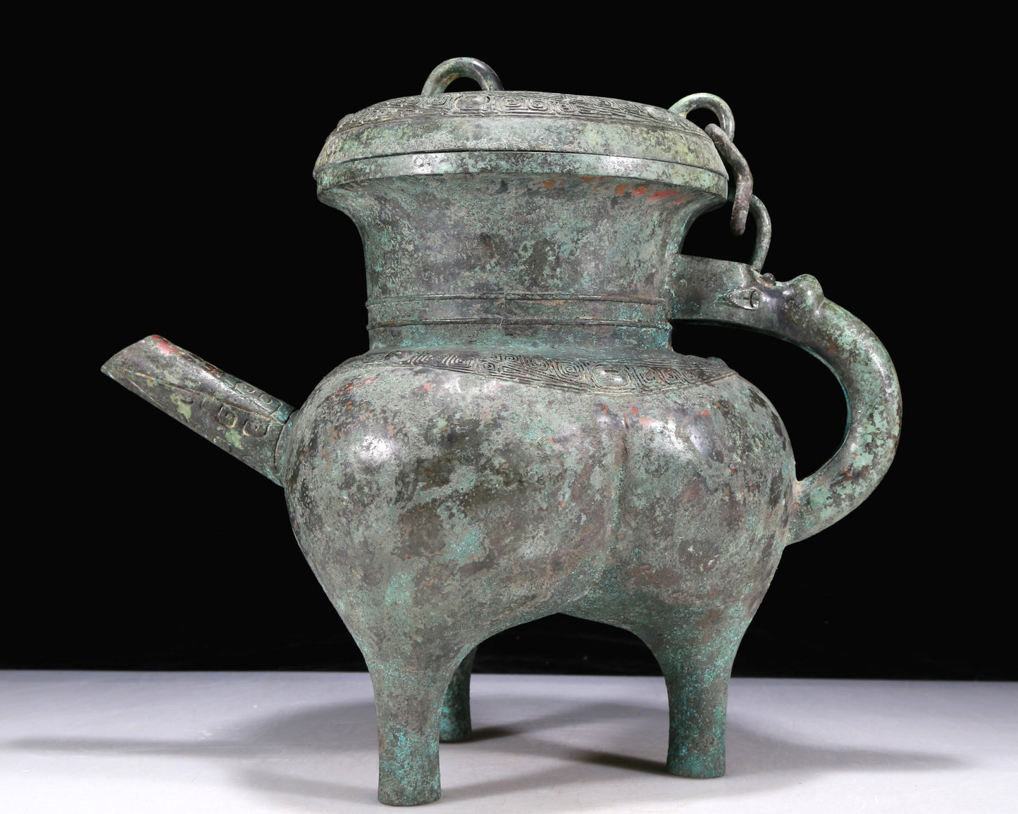 An Excellent Bronze 'Auspicious Beast' Tripod Ewer