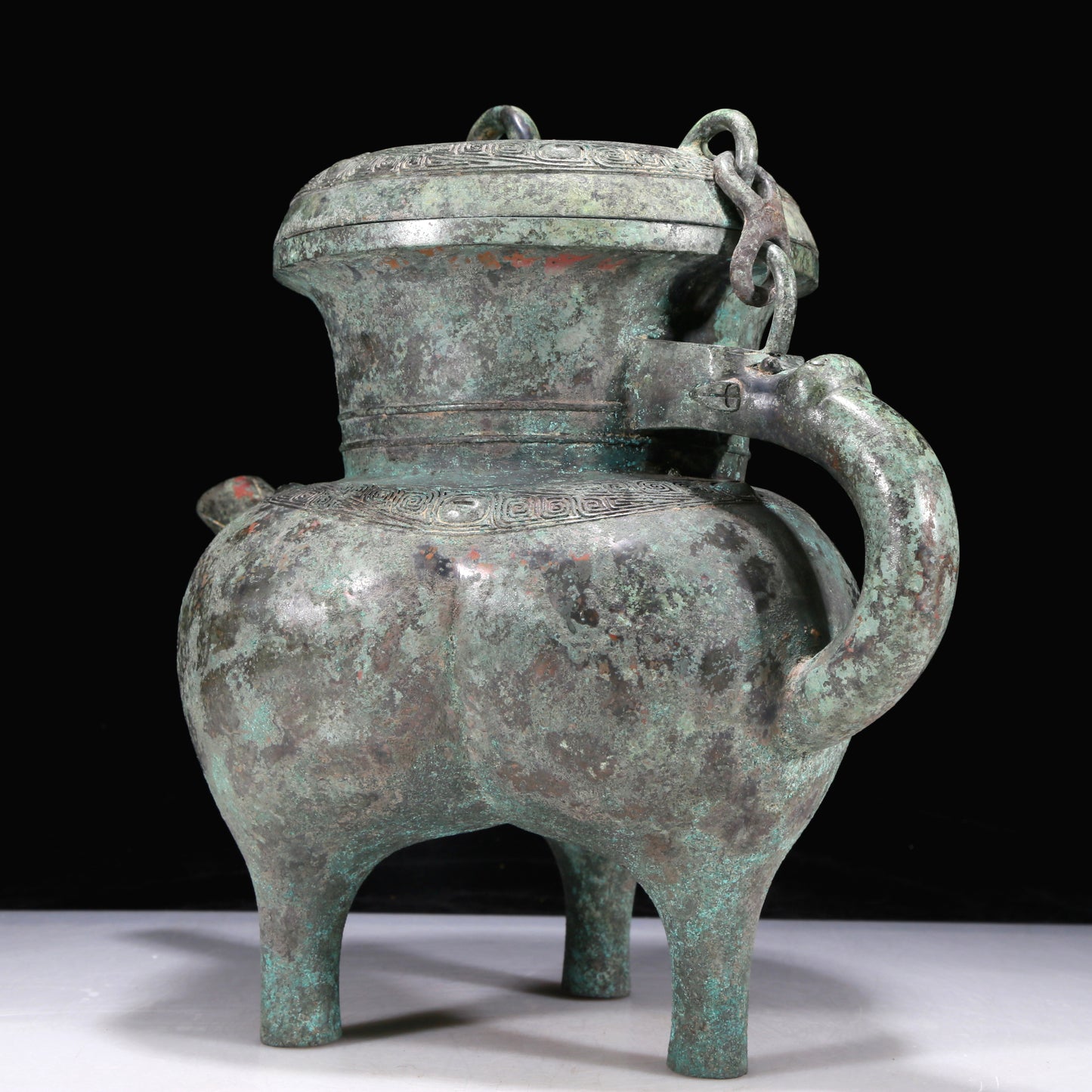 An Excellent Bronze 'Auspicious Beast' Tripod Ewer