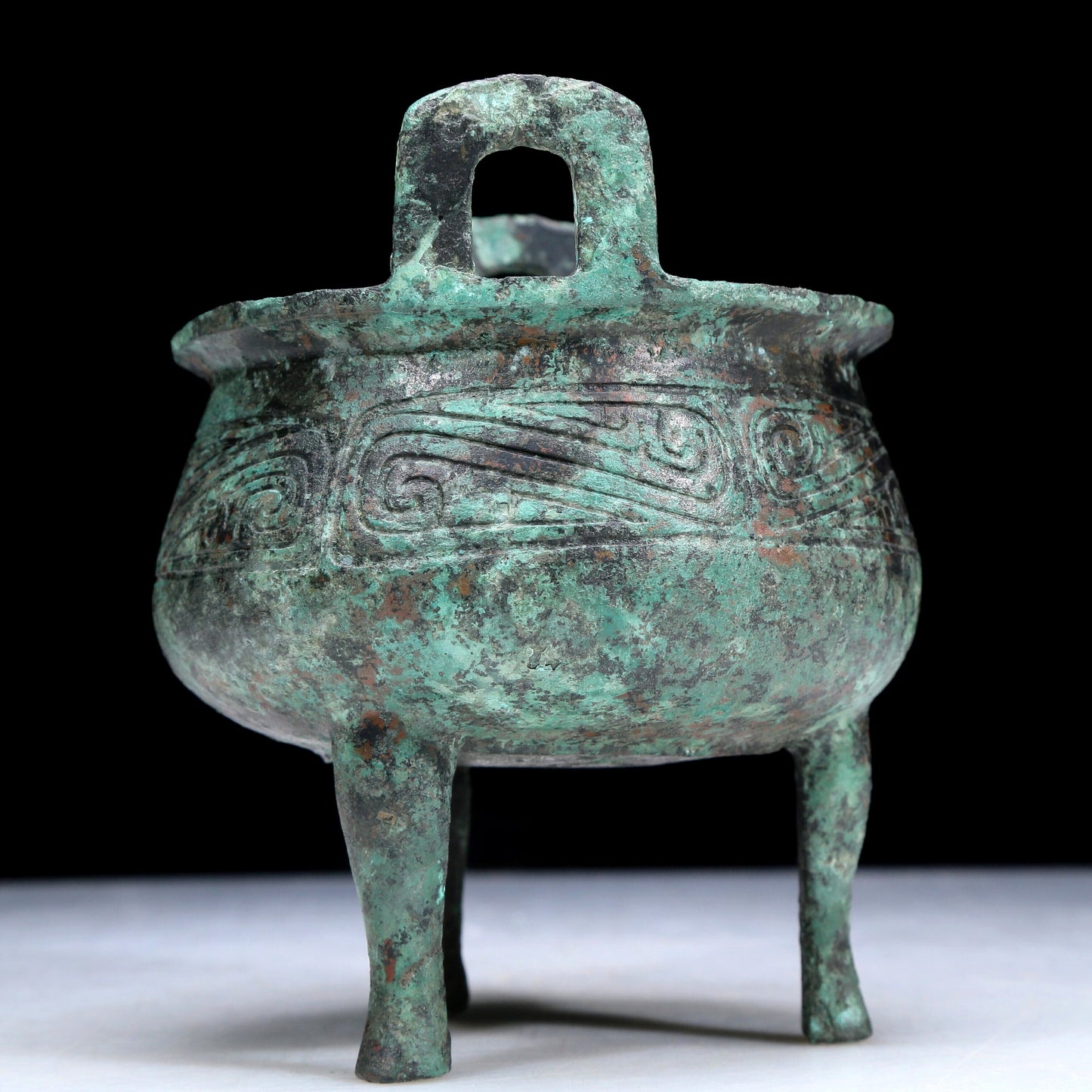 An Archaic Bronze 'Auspicious Cloud' Tripod Censer