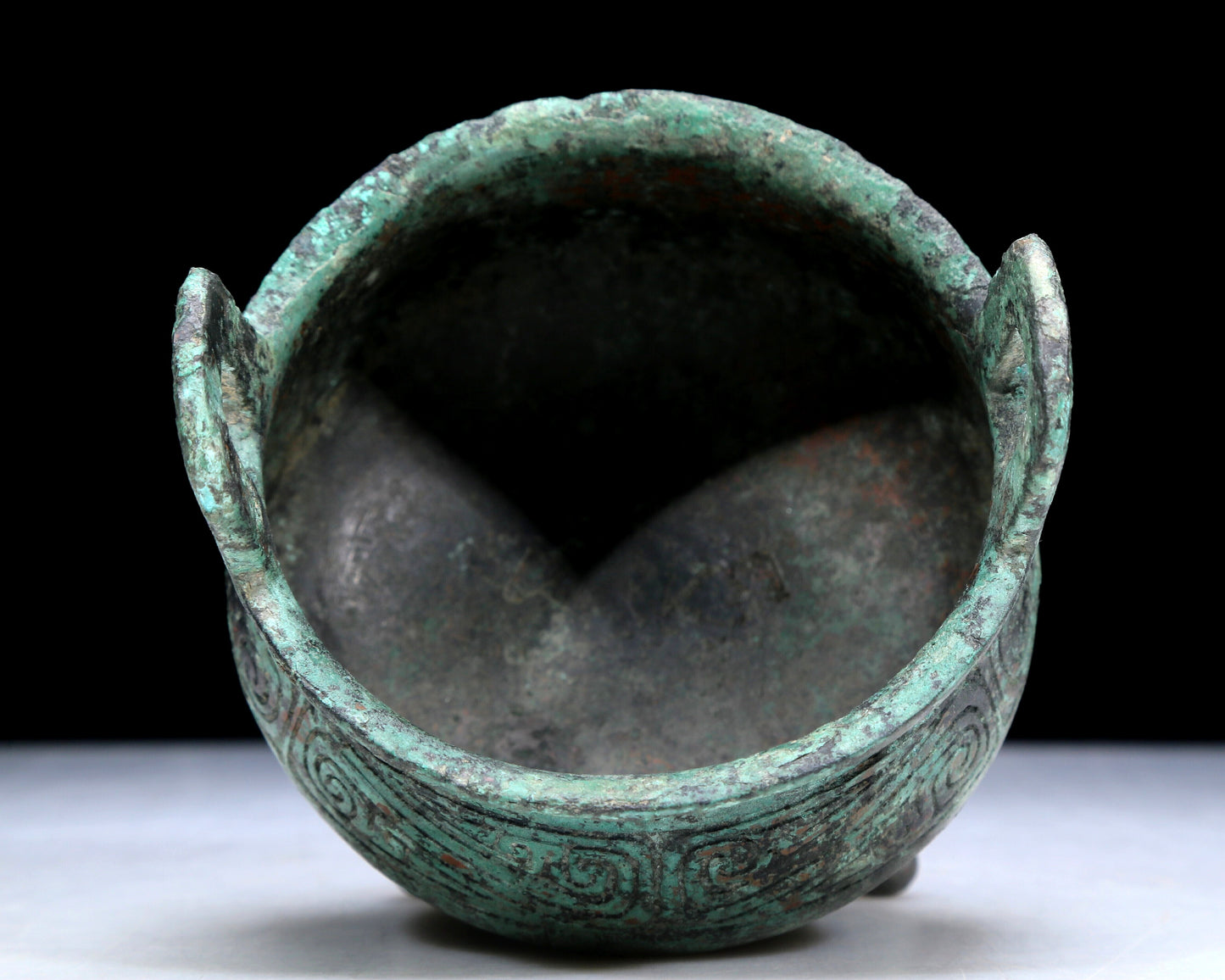 An Archaic Bronze 'Auspicious Cloud' Tripod Censer