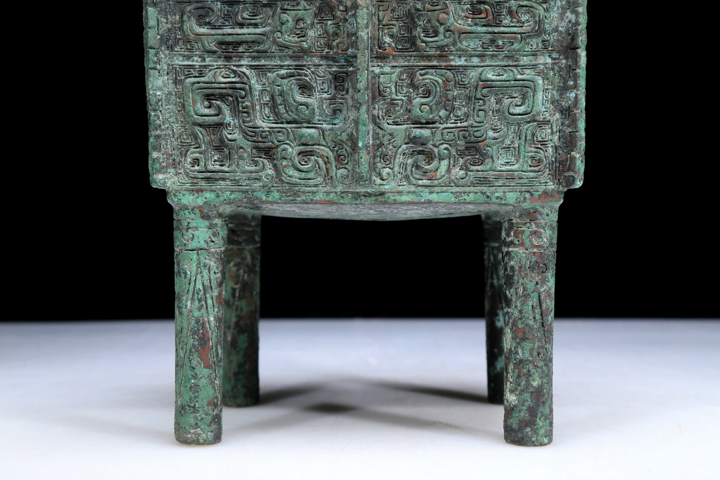 An Archaic Bronze 'Animal Mask' Ritual Food Vessel, Ding