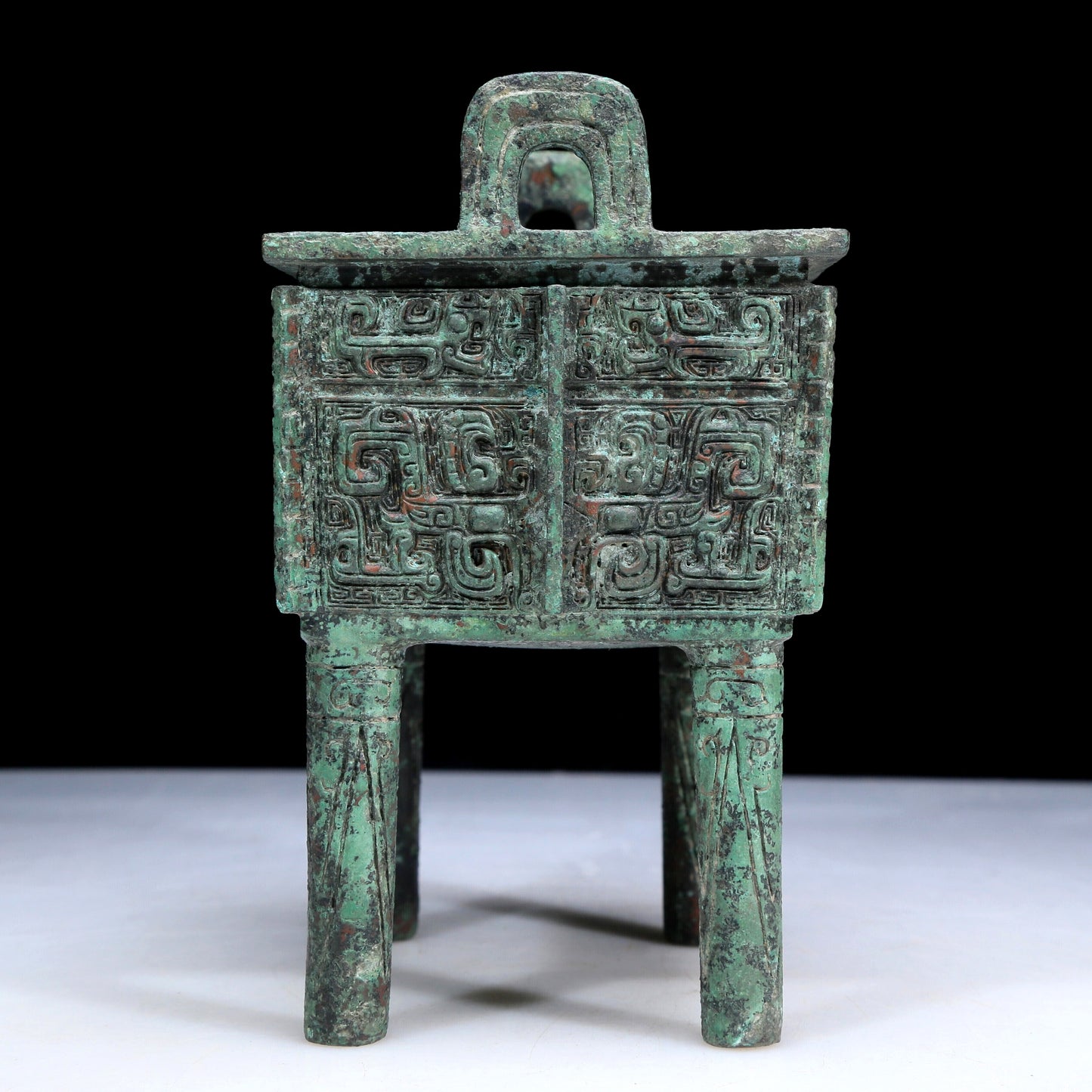 An Archaic Bronze 'Animal Mask' Ritual Food Vessel, Ding