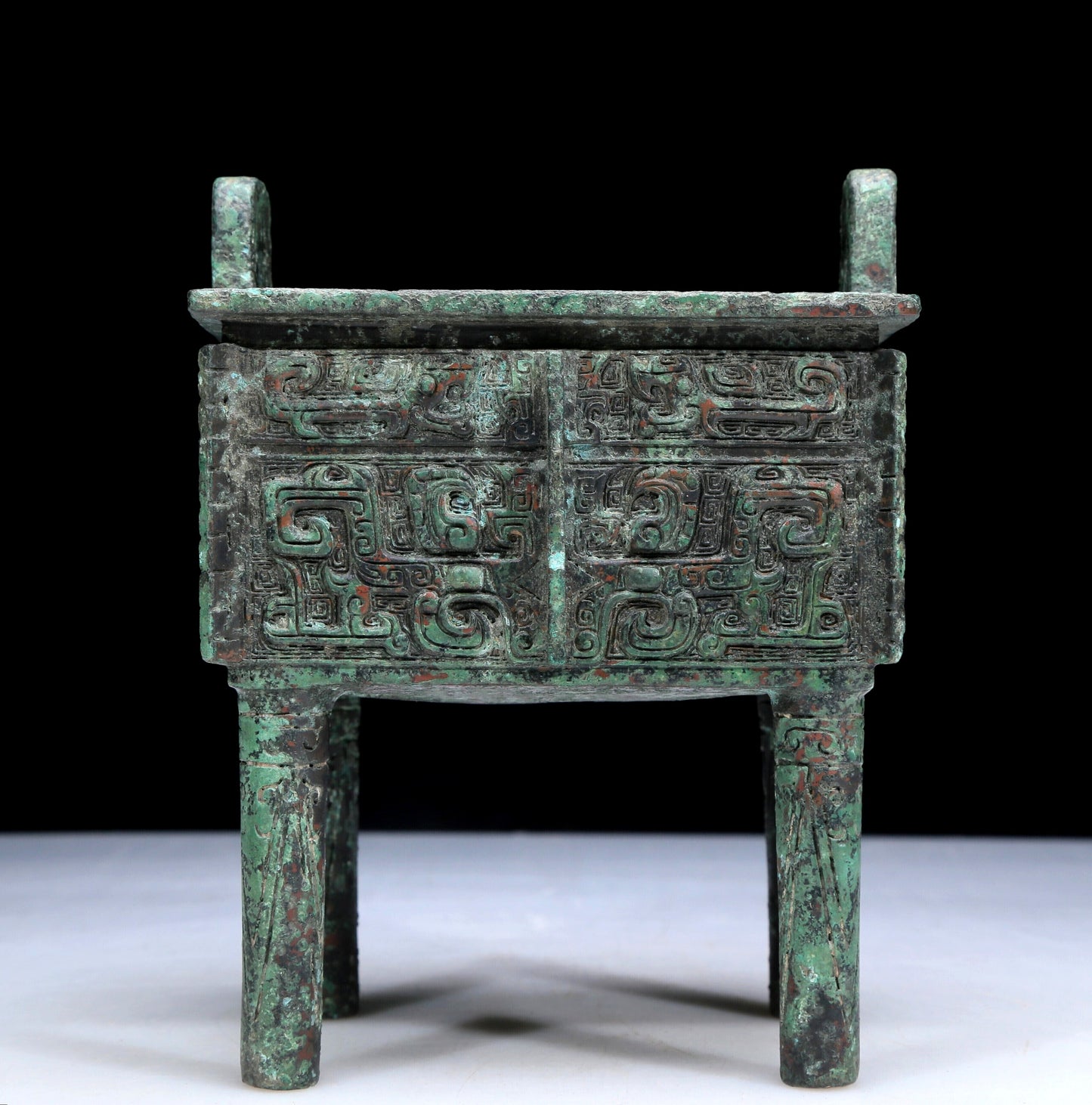 An Archaic Bronze 'Animal Mask' Ritual Food Vessel, Ding