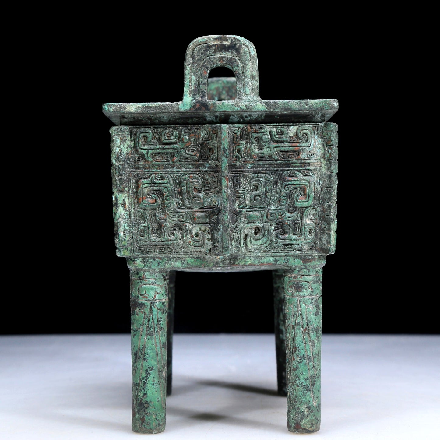 An Archaic Bronze 'Animal Mask' Ritual Food Vessel, Ding