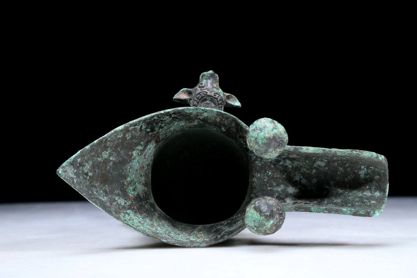An Archaic Bronze 'Animal Mask' Tripod Cup