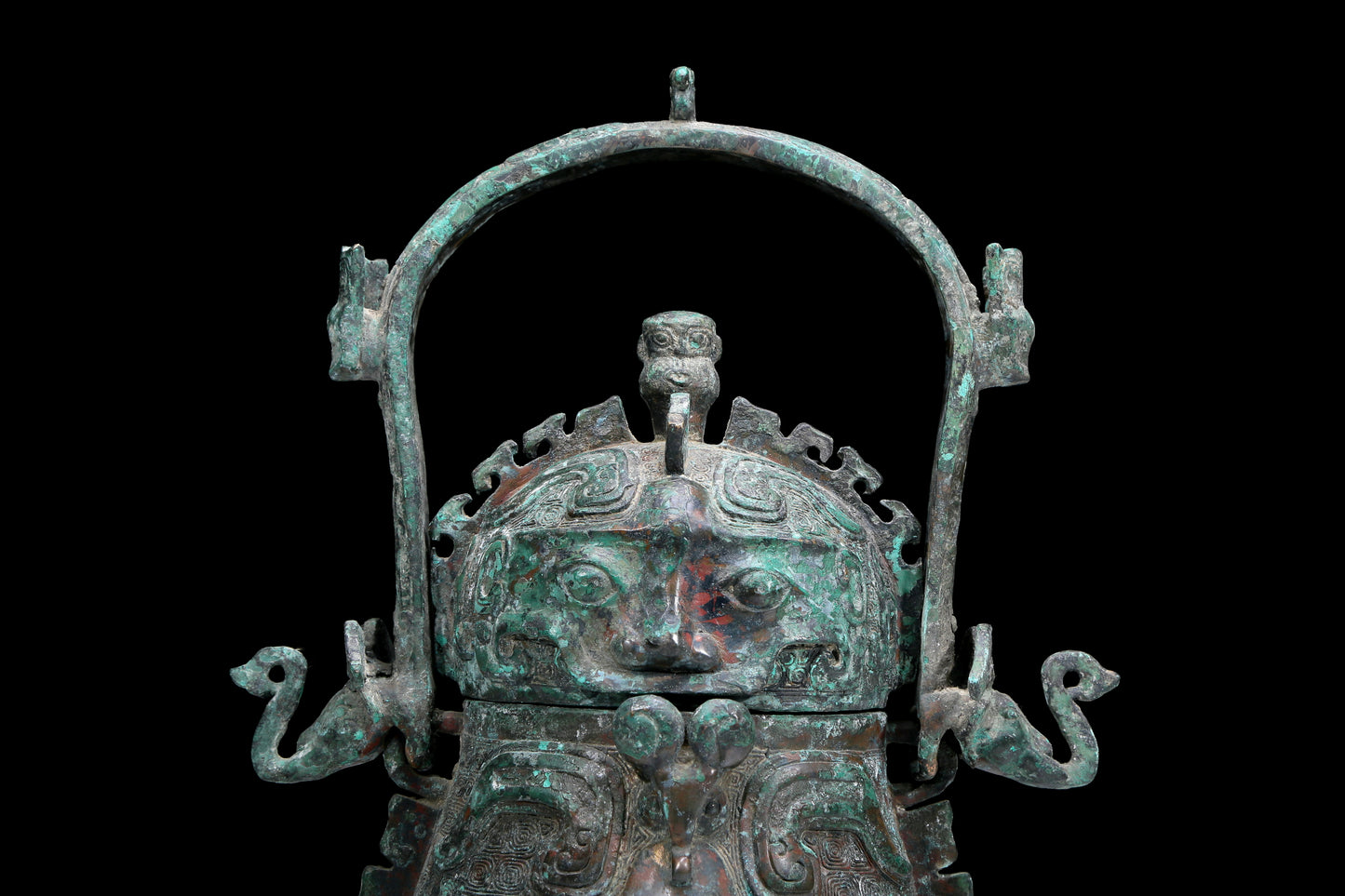 An Archaic Bronze 'Animal Mask' Pot With Inscriptions And An Overhead Handle