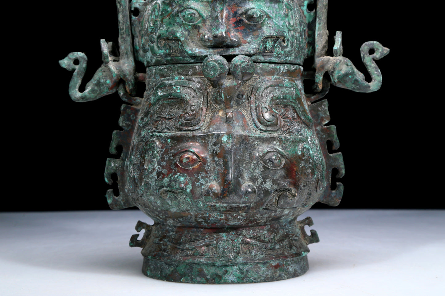 An Archaic Bronze 'Animal Mask' Pot With Inscriptions And An Overhead Handle