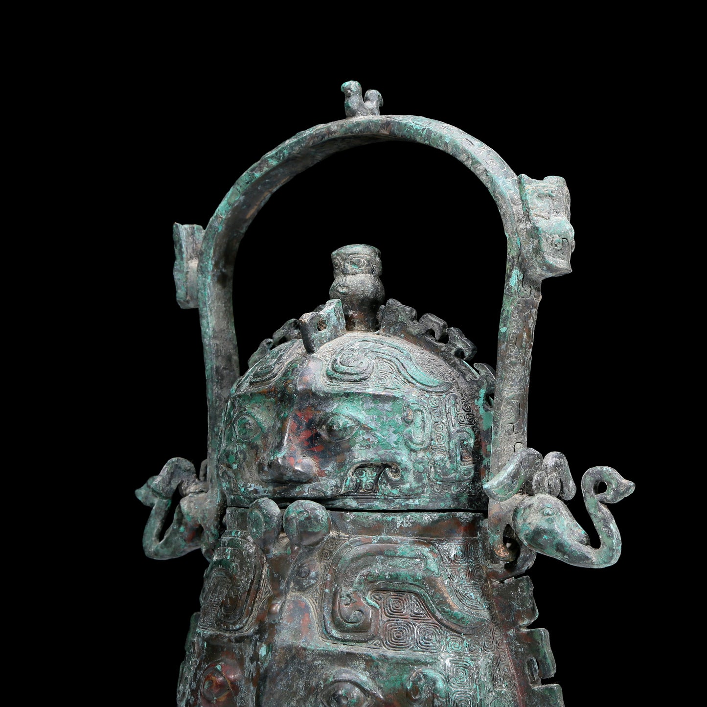 An Archaic Bronze 'Animal Mask' Pot With Inscriptions And An Overhead Handle