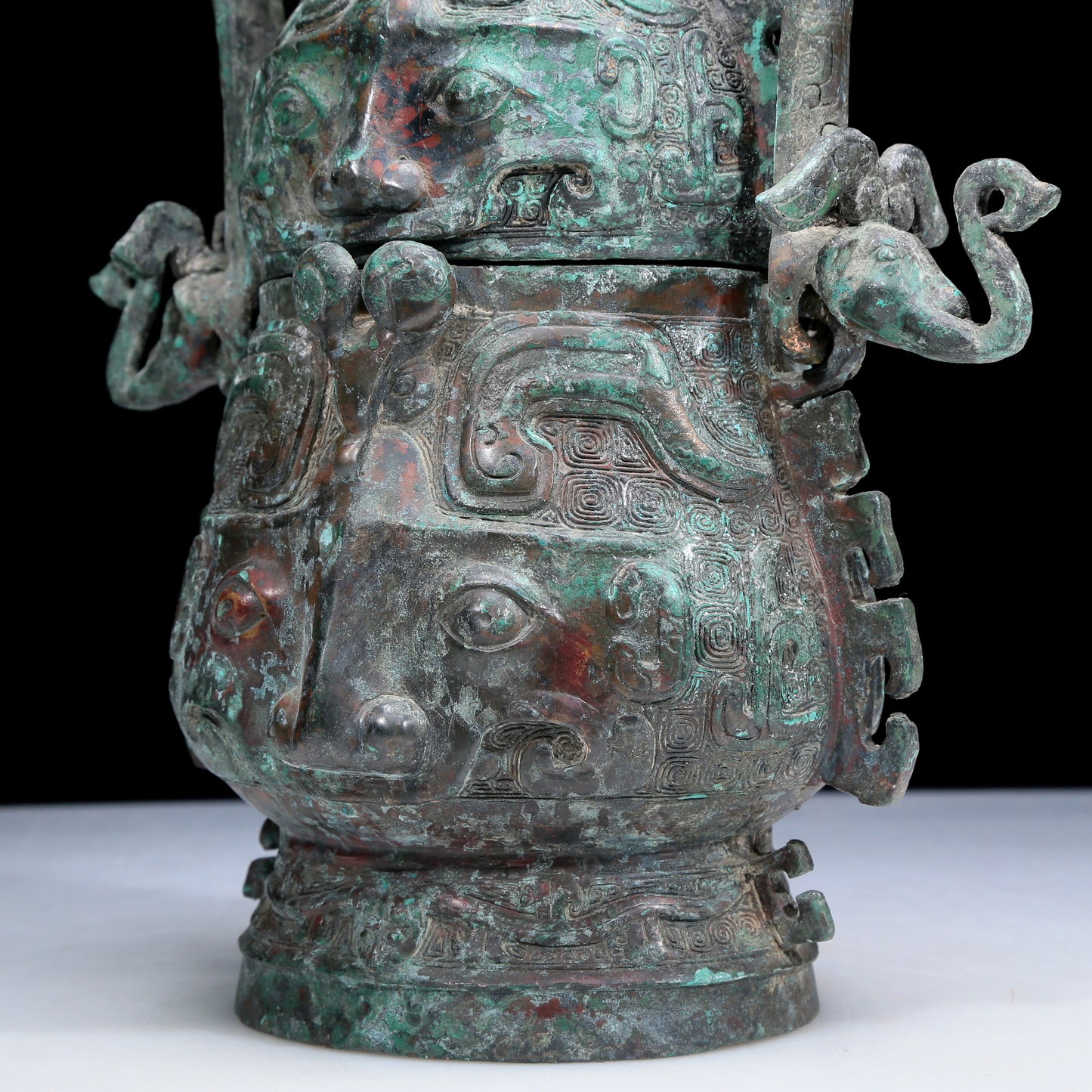 An Archaic Bronze 'Animal Mask' Pot With Inscriptions And An Overhead Handle