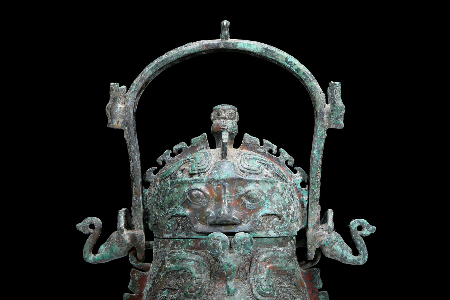 An Archaic Bronze 'Animal Mask' Pot With Inscriptions And An Overhead Handle