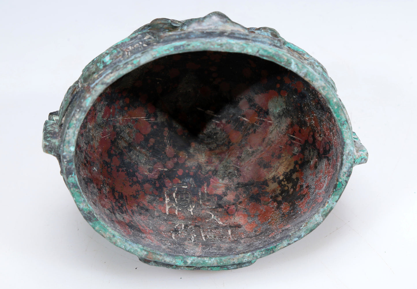 An Archaic Bronze 'Animal Mask' Pot With Inscriptions And An Overhead Handle