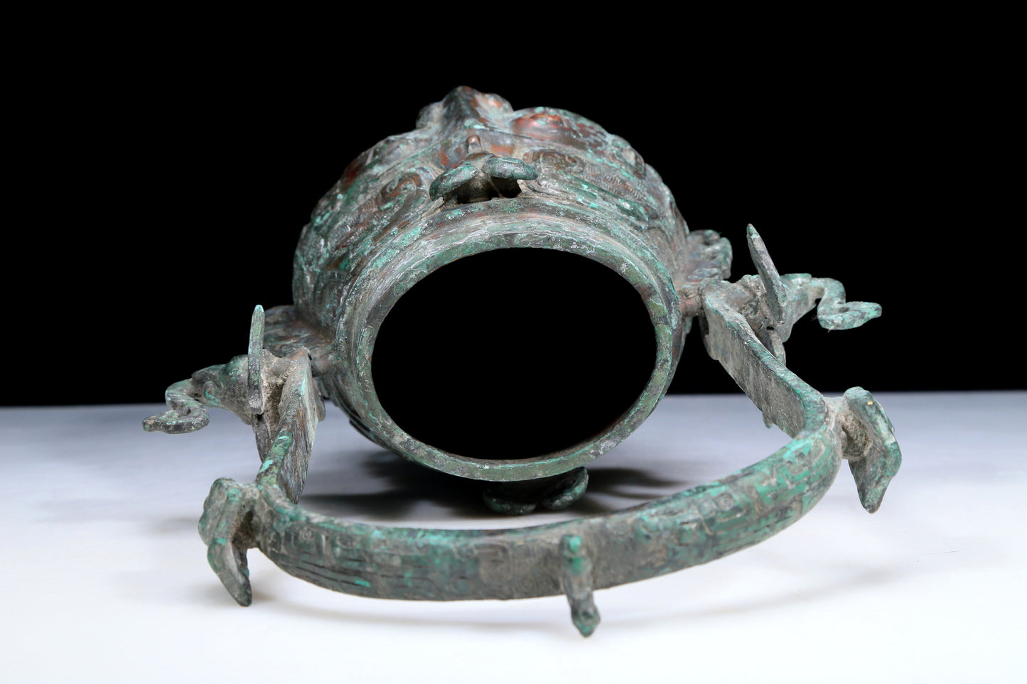 An Archaic Bronze 'Animal Mask' Pot With Inscriptions And An Overhead Handle