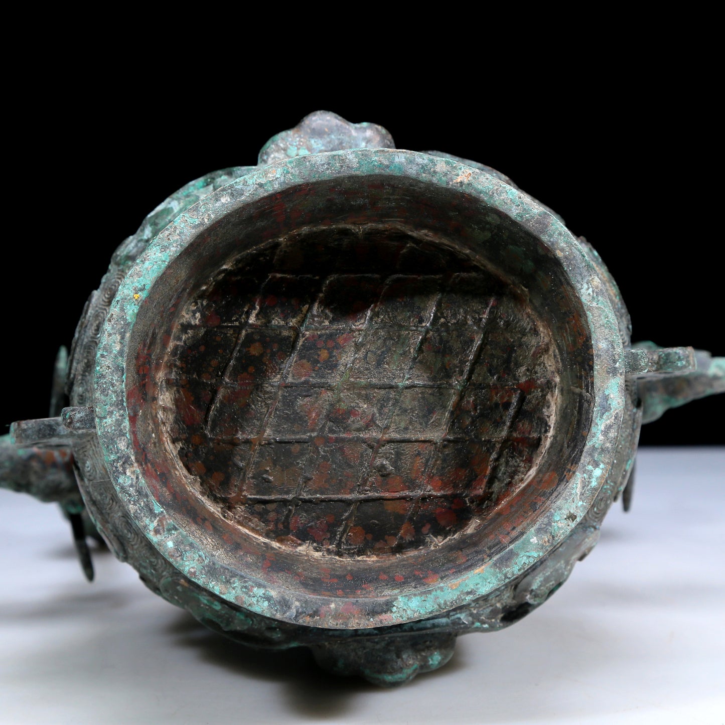 An Archaic Bronze 'Animal Mask' Pot With Inscriptions And An Overhead Handle