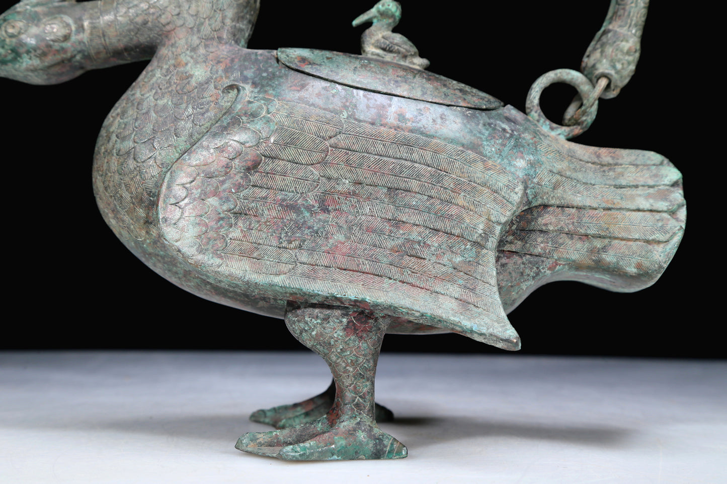 An Archaic Bronze Duck-Form Pot With Inscriptions And An Overhead Handle