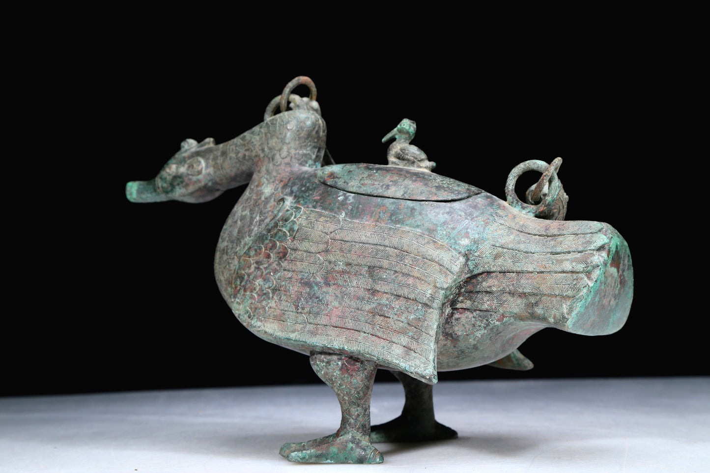 An Archaic Bronze Duck-Form Pot With Inscriptions And An Overhead Handle