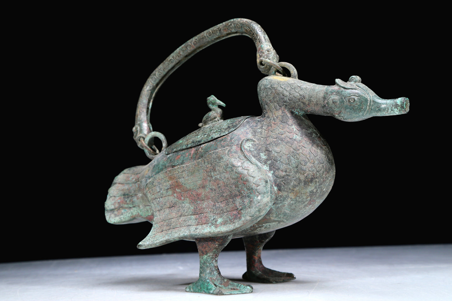 An Archaic Bronze Duck-Form Pot With Inscriptions And An Overhead Handle